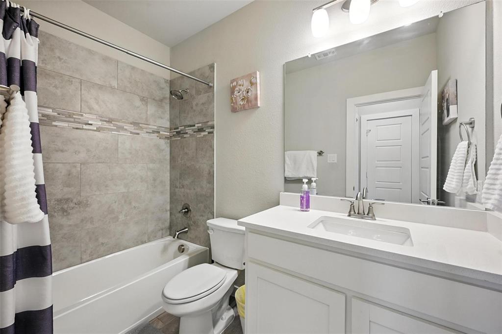 113 Nathan Drive Princeton, TX 75407 - Photo 18 of 39 a bathroom with a sink a toilet and a bathtub