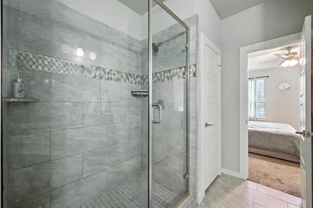 a bathroom with double sink and a mirror