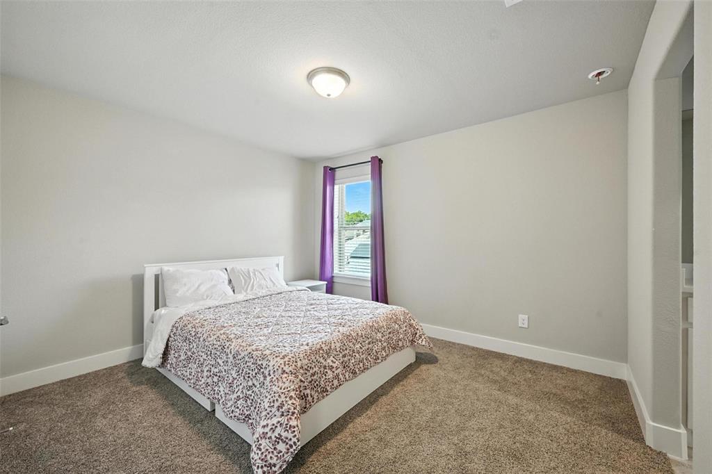 113 Nathan Drive Princeton, TX 75407 - Photo 27 of 39 a bedroom with a bed and a window