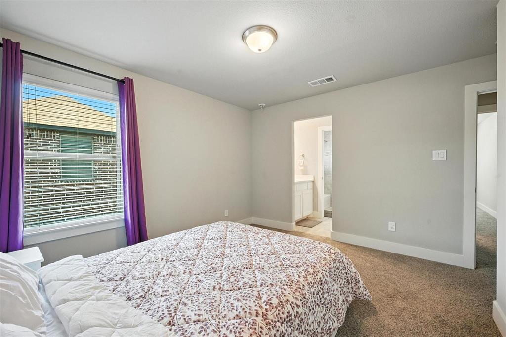 113 Nathan Drive Princeton, TX 75407 - Photo 29 of 39 a bedroom with a bed and a large window