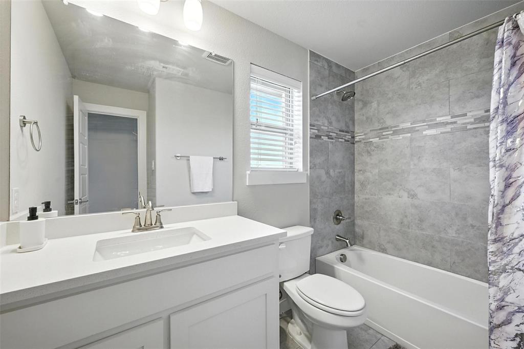 113 Nathan Drive Princeton, TX 75407 - Photo 34 of 39 a bathroom with a sink toilet and shower