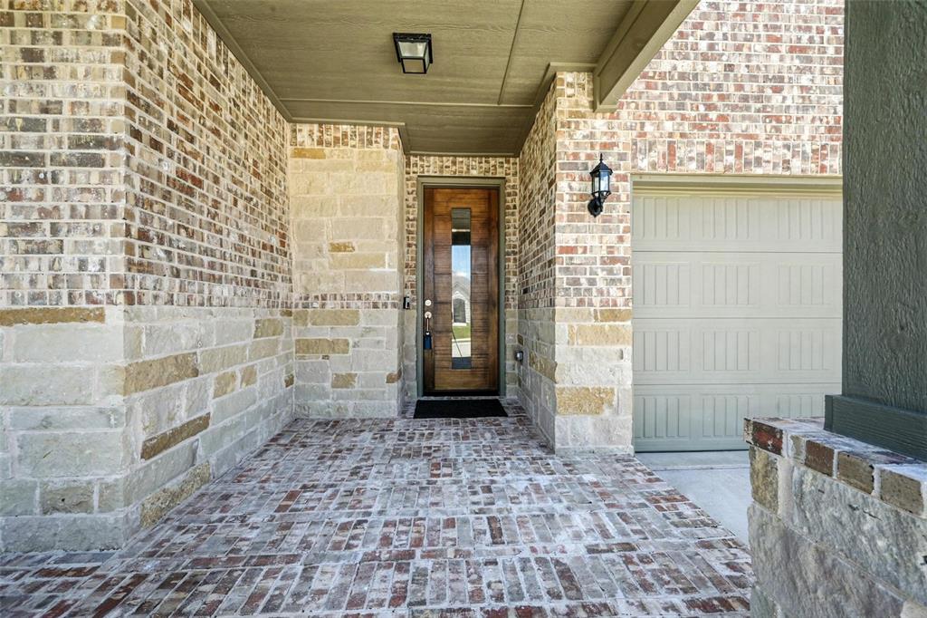 113 Nathan Drive Princeton, TX 75407 - Photo 4 of 39 a view of a door with a wooden door