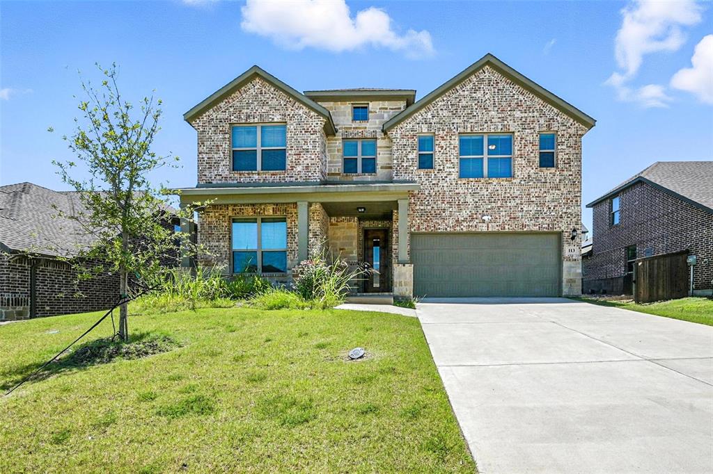 113 Nathan Drive Princeton, TX 75407 - Photo 5 of 39 a front view of a house with a yard and garage