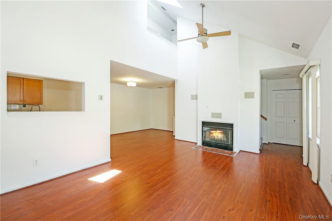599 Midland Avenue, Unit 25 Rye, NY 10580 - Photo 9 of 25 Living room with skylight and fireplace