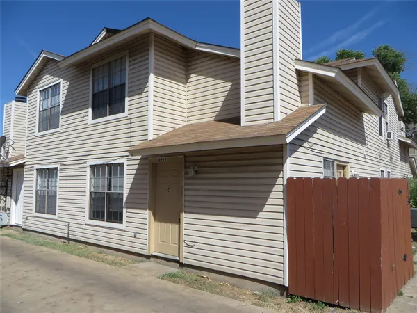 a view of a house with a yard and garage