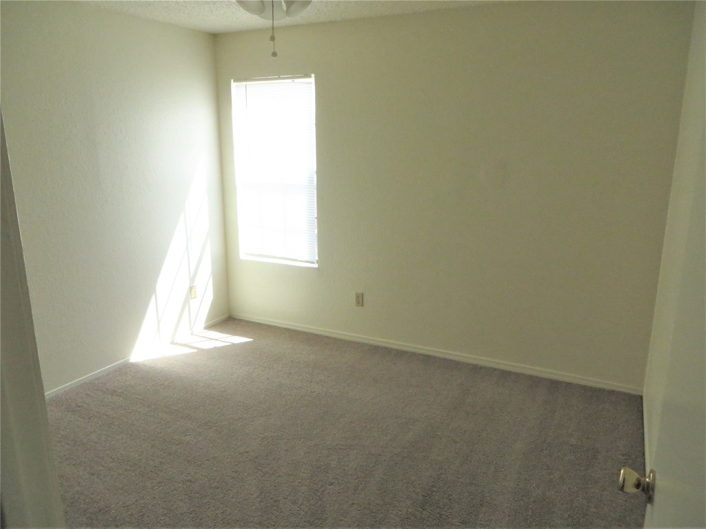 2217 Katy Lane, Unit C Georgetown, TX 78626 - Photo 17 of 21 an empty room with a window