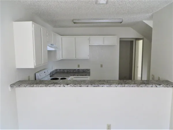 a view of lot of kitchen and window