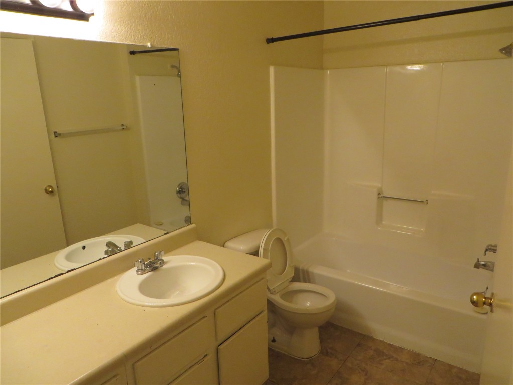 2217 Katy Lane, Unit C Georgetown, TX 78626 - Photo 21 of 21 a bathroom with a sink toilet and shower