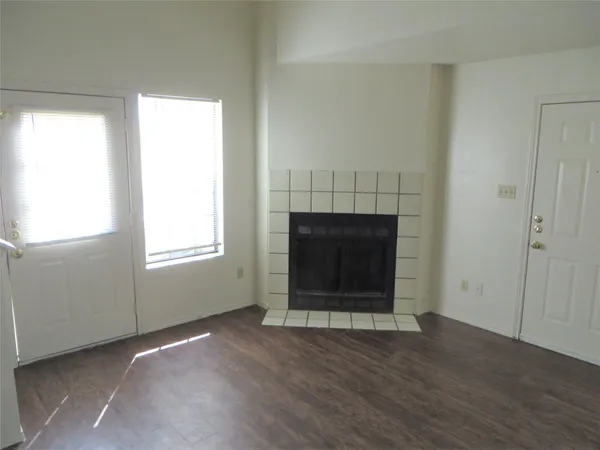 an empty room with a fireplace