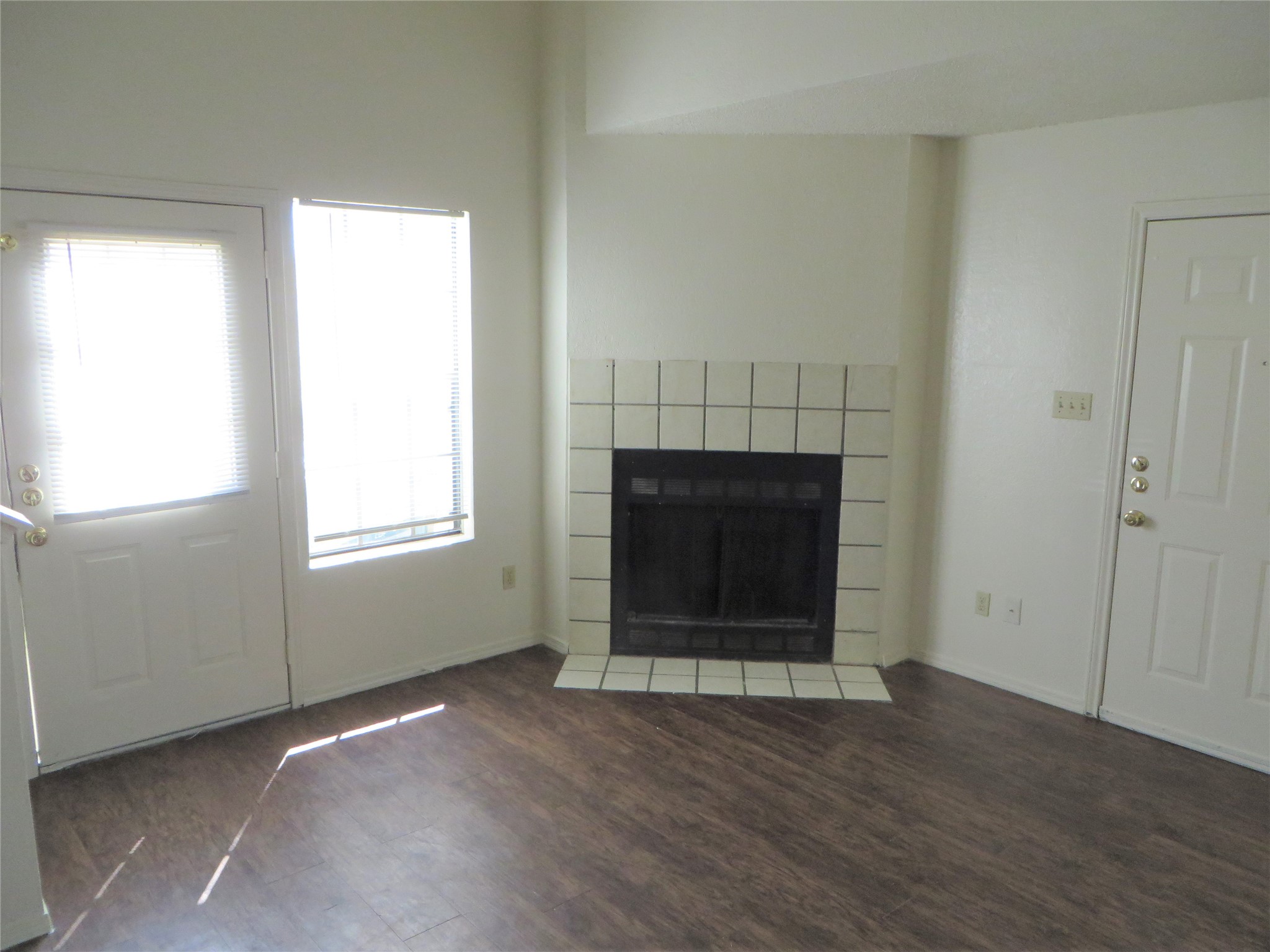 2217 Katy Lane, Unit C Georgetown, TX 78626 - Photo 4 of 21 an empty room with a fireplace