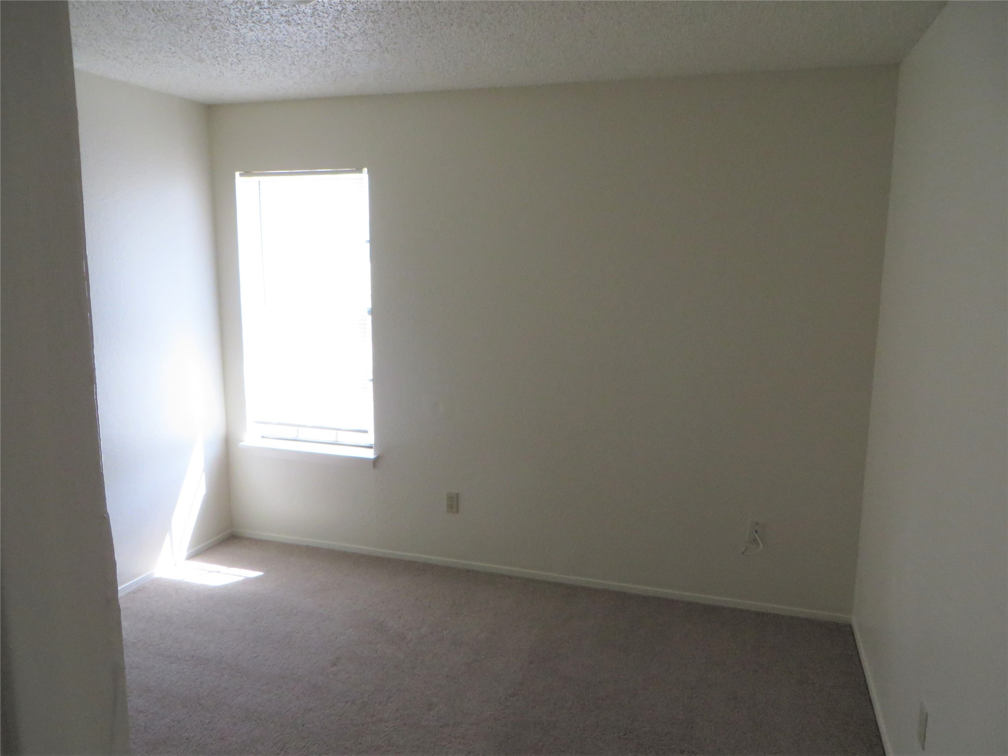 2217 Katy Lane, Unit C Georgetown, TX 78626 - Photo 7 of 21 an empty room with a window