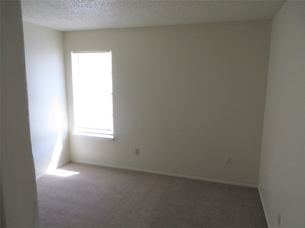 2217 Katy Lane, Unit C Georgetown, TX 78626 - Photo 7 of 21 an empty room with a window