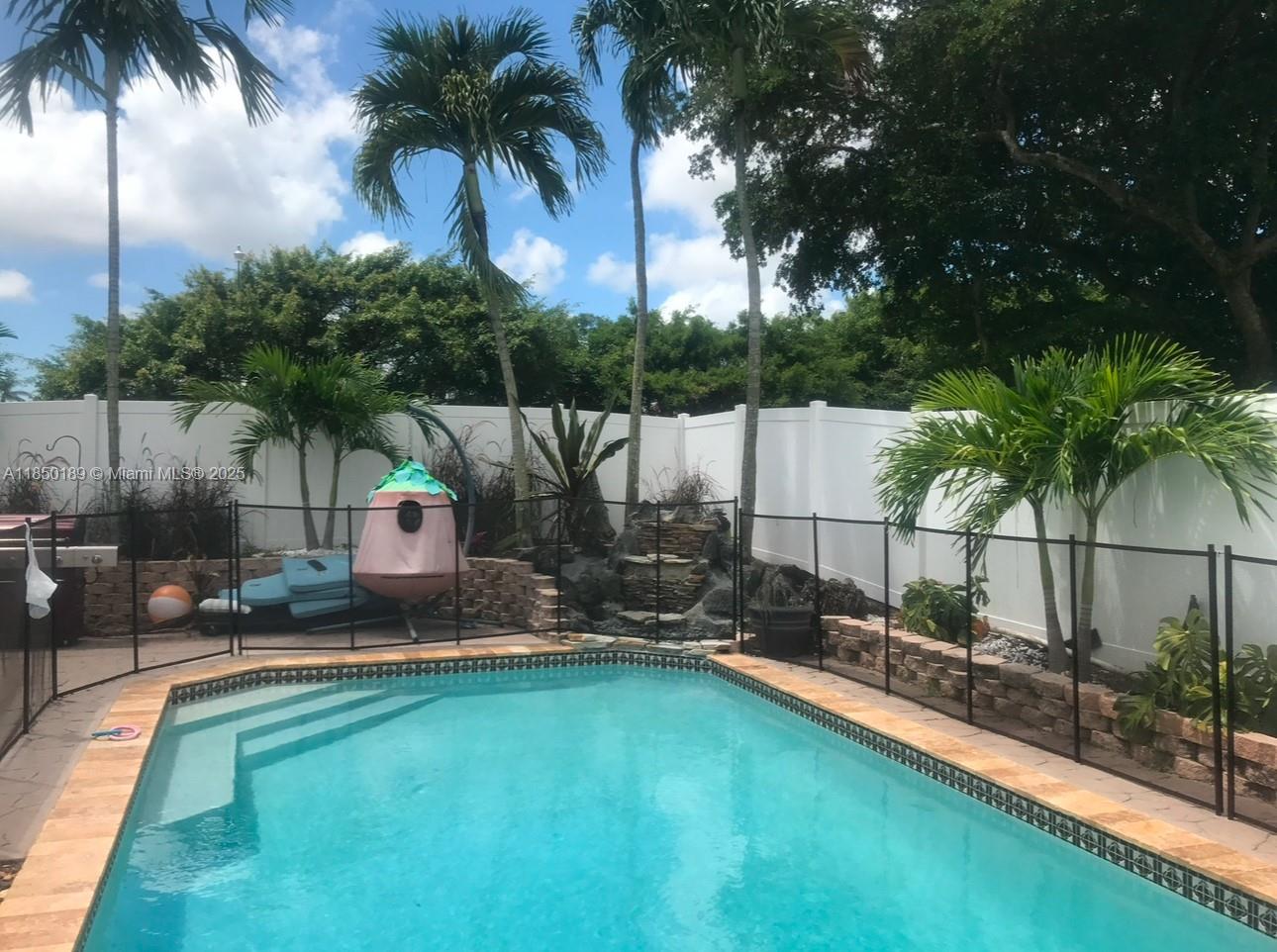 21595 Redbay Road Boca Raton, FL 33433 - Photo 2 of 2 a house with swimming pool