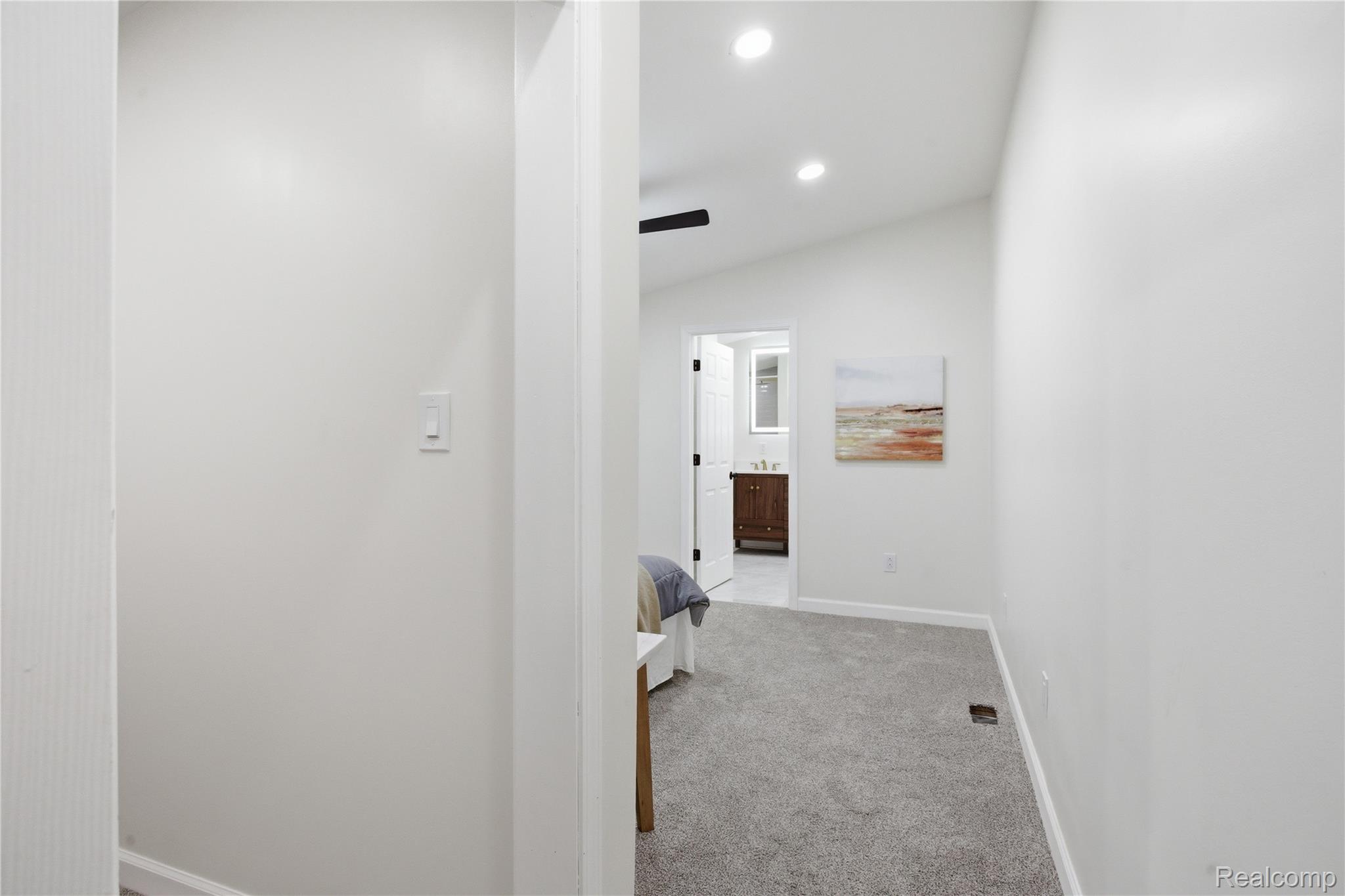 5350 List Road Grass Lake, MI 49240 - Photo 22 of 71 Corridor featuring light carpet, lofted ceiling, and recessed lighting