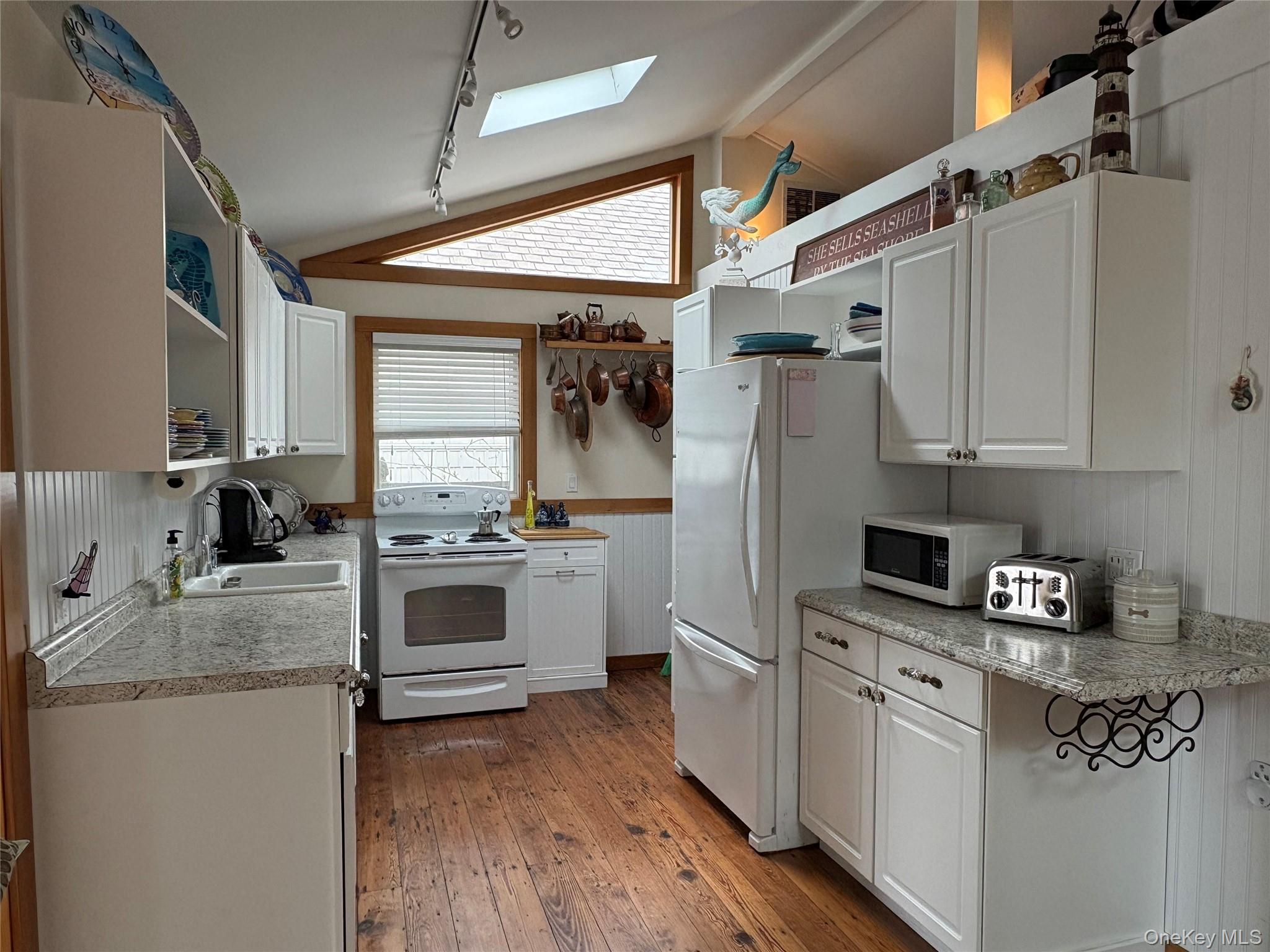 177 Wilmot Road Ocean Beach, NY 11770 - Photo 3 of 12 a kitchen with granite countertop a sink stainless steel appliances and cabinets
