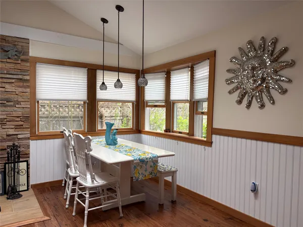 a view of a dining room with furniture window and outside view