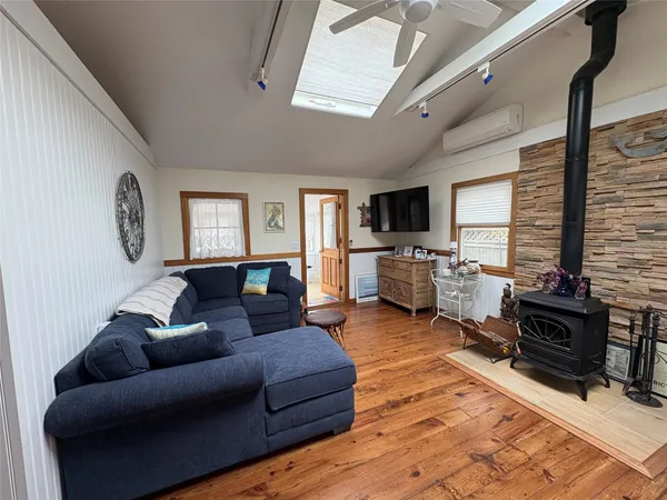 a living room with furniture window and a flat screen tv