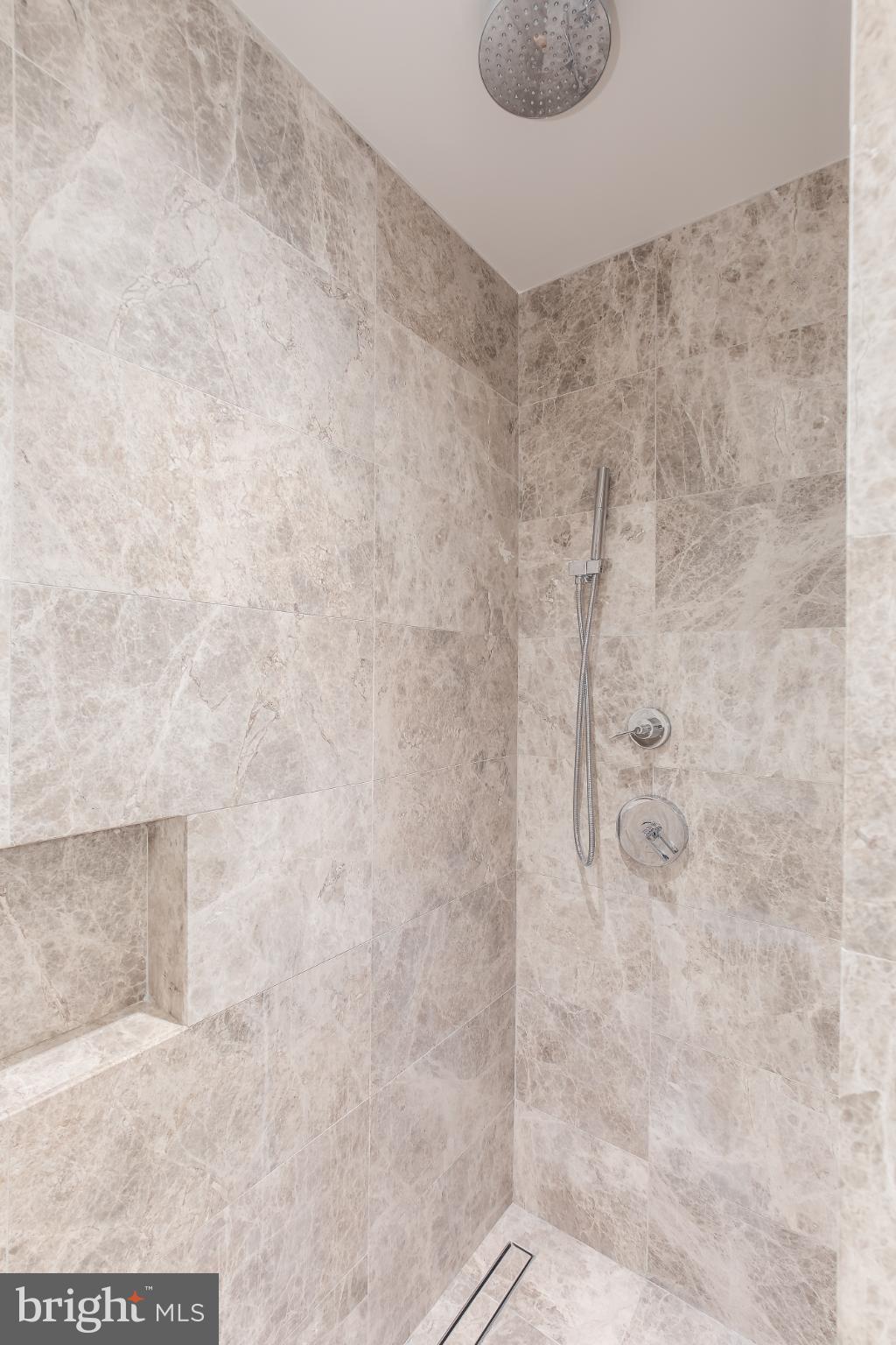 601 Wharf Street Southwest, Unit 412 Washington, DC 20024 - Photo 16 of 38 Primary Bath marble shower