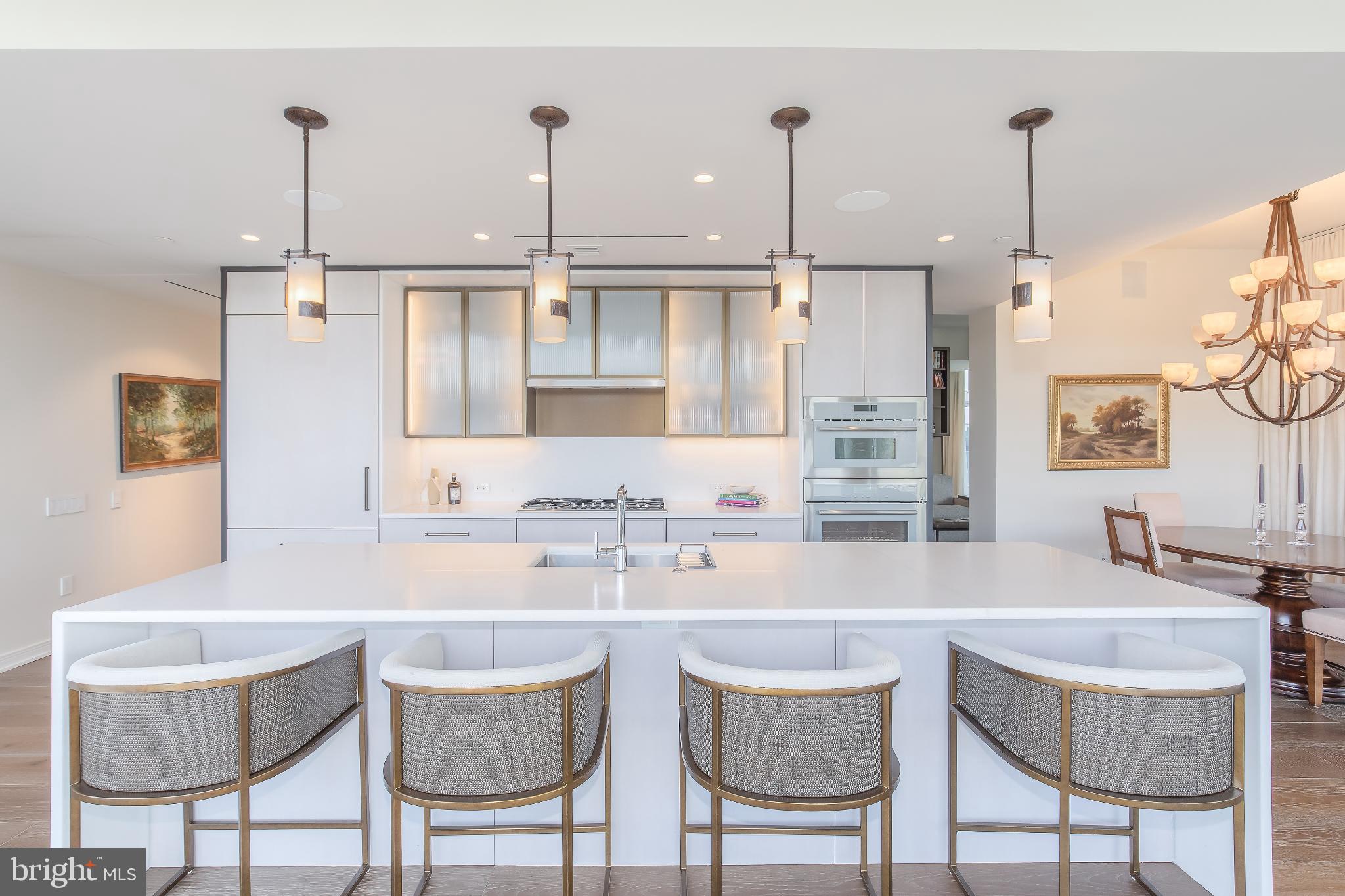601 Wharf Street Southwest, Unit 412 Washington, DC 20024 - Photo 5 of 38 Sleek modern kitchen with elegant lighting.
