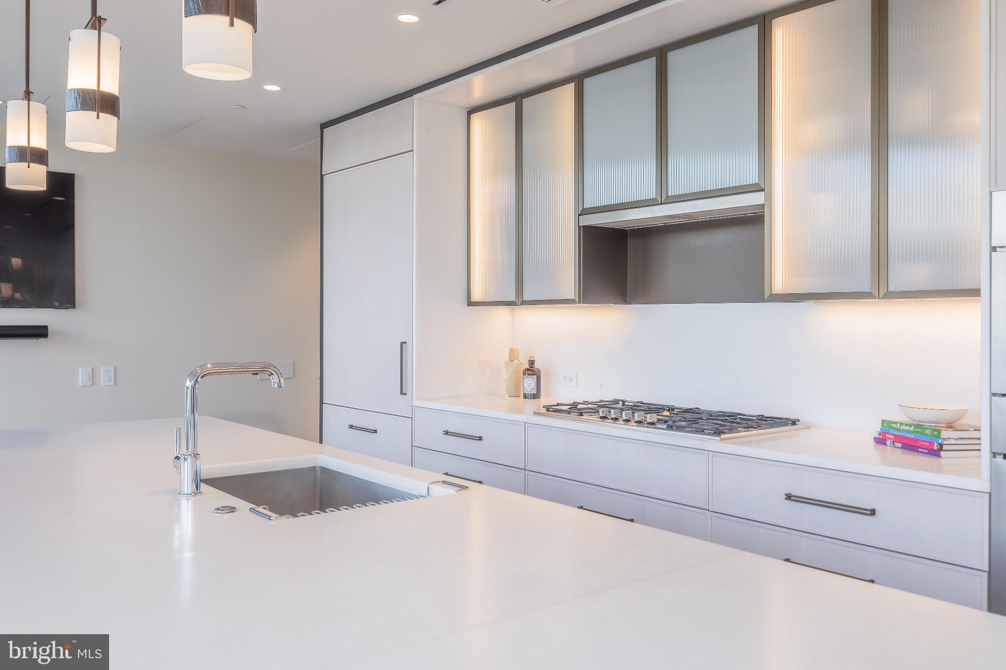 601 Wharf Street Southwest, Unit 412 Washington, DC 20024 - Photo 6 of 38 Sleek modern kitchen with elegant finishes.