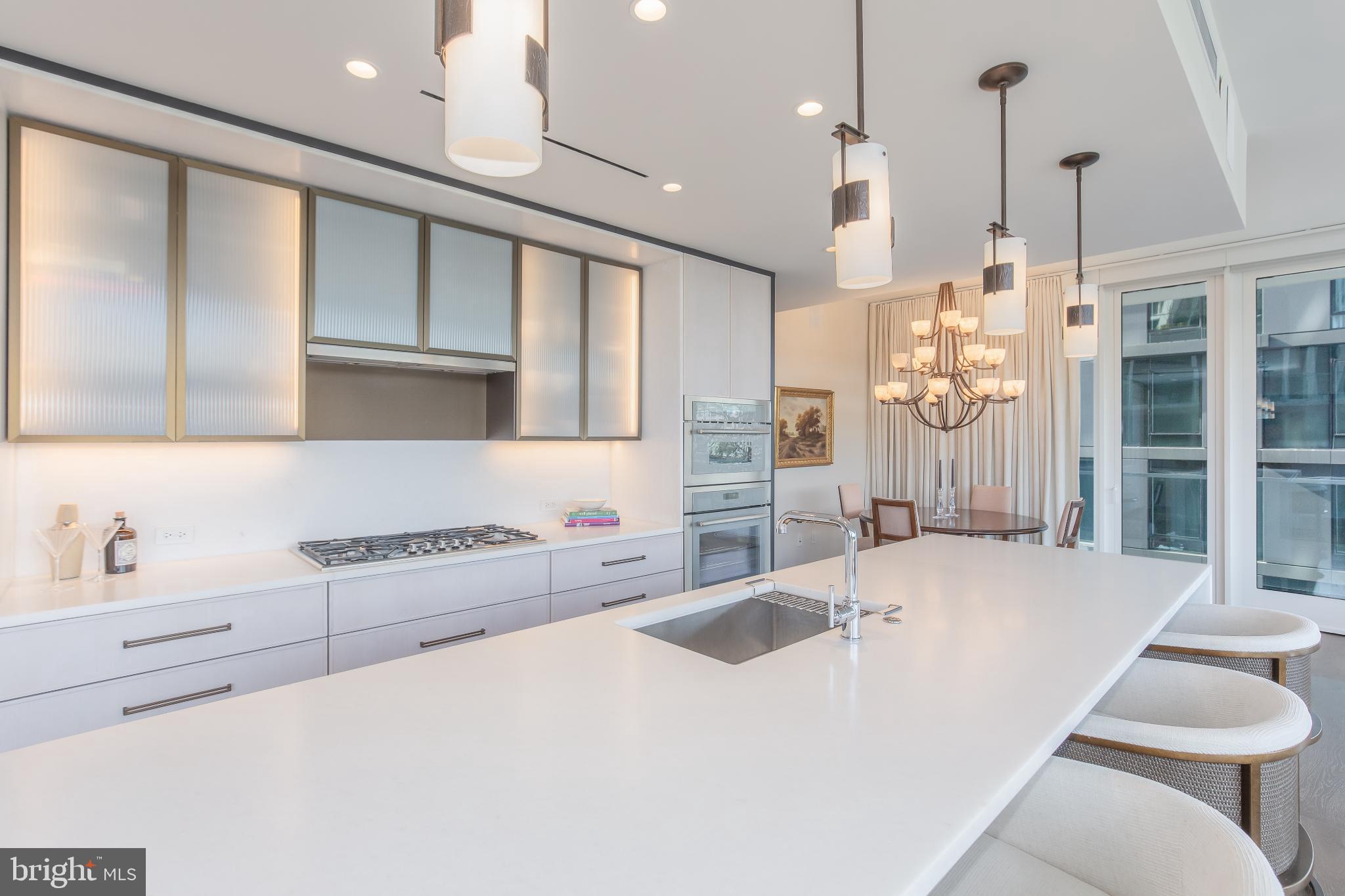601 Wharf Street Southwest, Unit 412 Washington, DC 20024 - Photo 8 of 38 Sleek modern kitchen with elegant lighting.