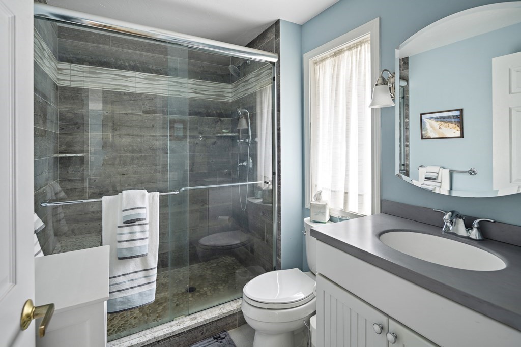64 Jernegan Pond Road Edgartown, MA 02539 - Photo 13 of 25 a bathroom with a sink a toilet and shower