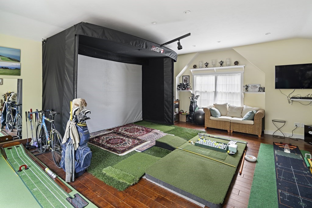 64 Jernegan Pond Road Edgartown, MA 02539 - Photo 23 of 25 a living room with furniture a flat screen tv and a table