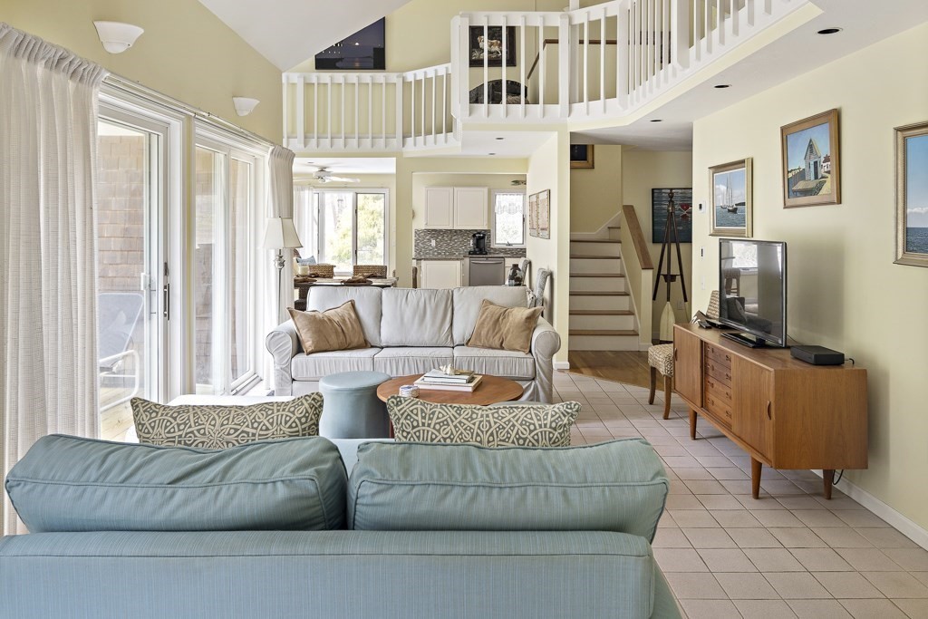 64 Jernegan Pond Road Edgartown, MA 02539 - Photo 3 of 25 a living room with furniture and a flat screen tv