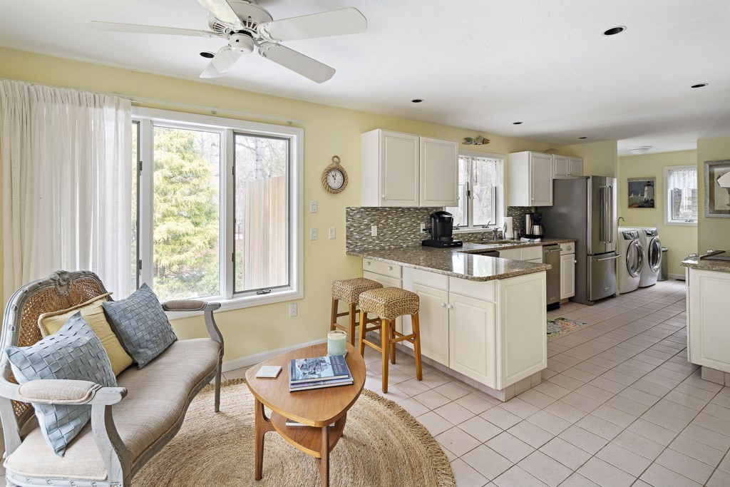 64 Jernegan Pond Road Edgartown, MA 02539 - Photo 7 of 25 a living room with furniture and a large window