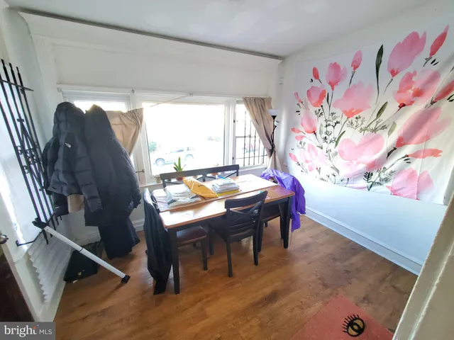 a view of a dining room with furniture and window