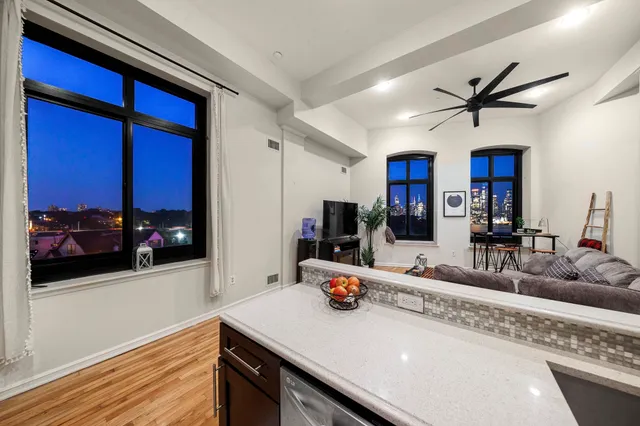 a kitchen with stainless steel appliances granite countertop a sink a microwave counter space and cabinets