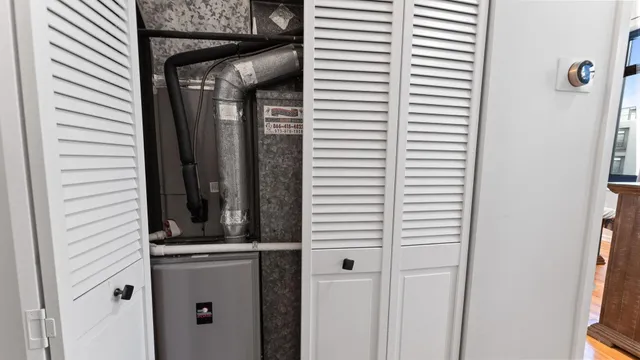 a view of a balcony and window in the backyard