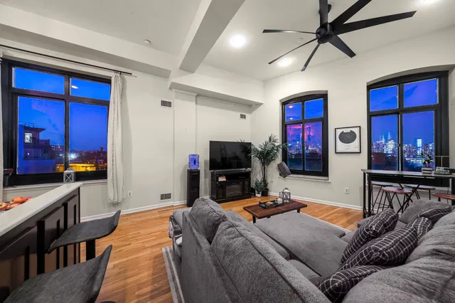 a kitchen with stainless steel appliances granite countertop a microwave a stove and refrigerator