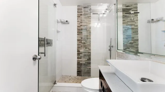 a bathroom with a bathtub and shower