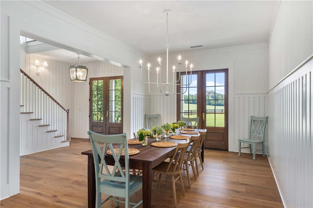 9311 Waterworks Road Chattahoochee Hills, GA 30268 - Photo 14 of 57 a view of a dining room with furniture window and wooden floor
