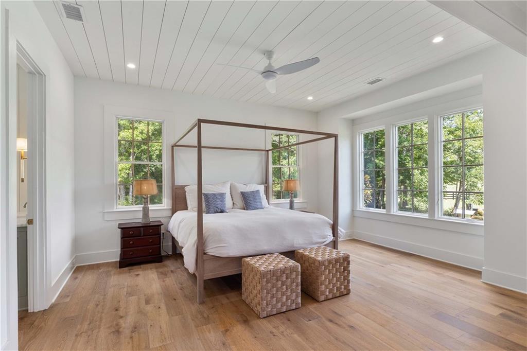 9311 Waterworks Road Chattahoochee Hills, GA 30268 - Photo 20 of 57 a bed room with a bed and a chair