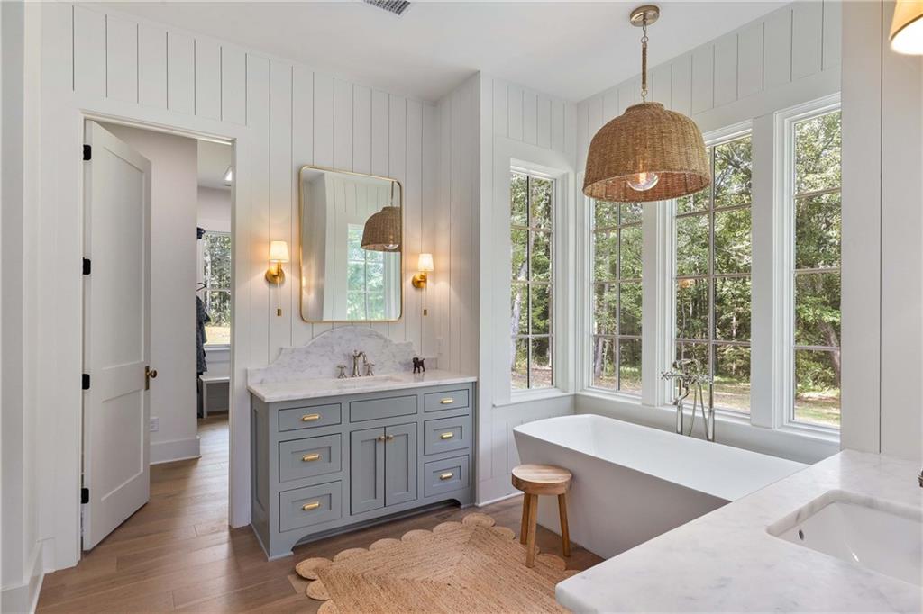 9311 Waterworks Road Chattahoochee Hills, GA 30268 - Photo 26 of 57 a spacious bathroom with sinks mirror and a bathtub