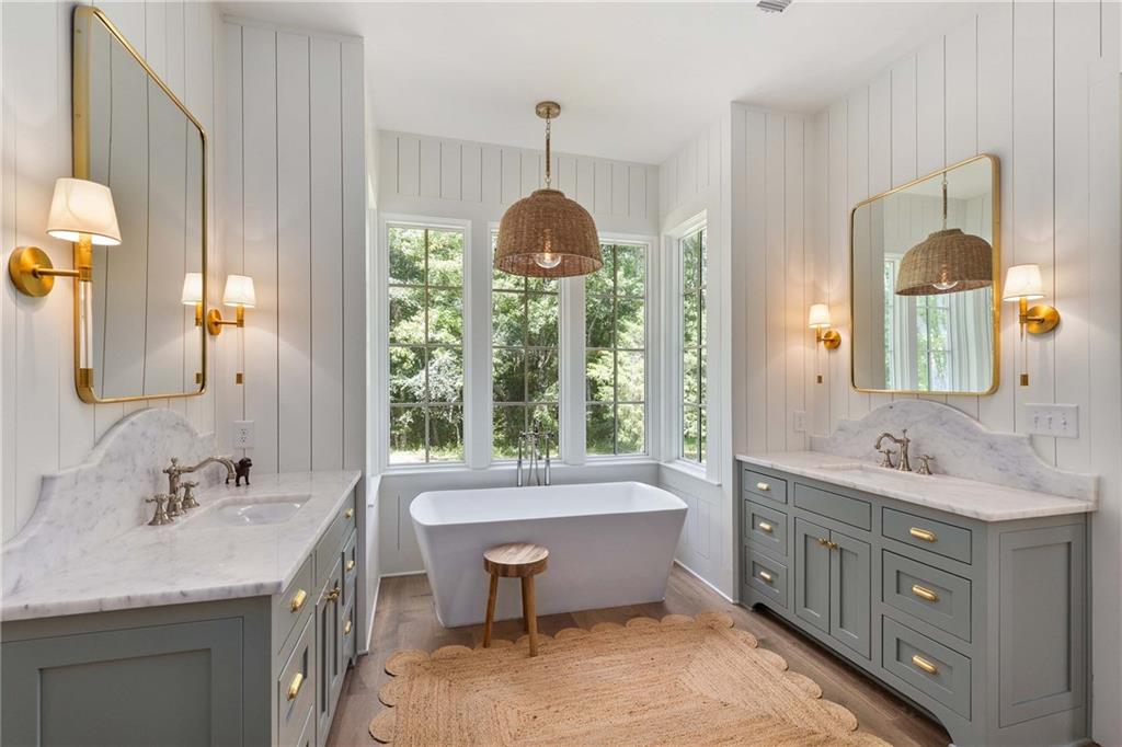 9311 Waterworks Road Chattahoochee Hills, GA 30268 - Photo 27 of 57 a bathroom with a double vanity sink mirror and bathtub