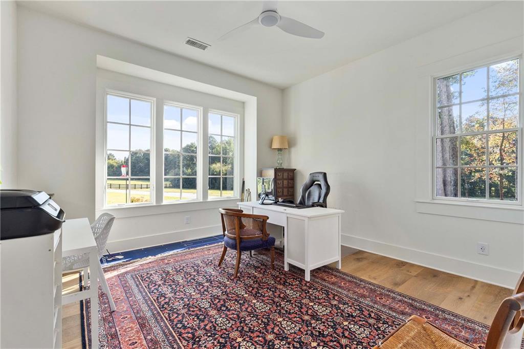 9311 Waterworks Road Chattahoochee Hills, GA 30268 - Photo 32 of 57 a living room with furniture and a window