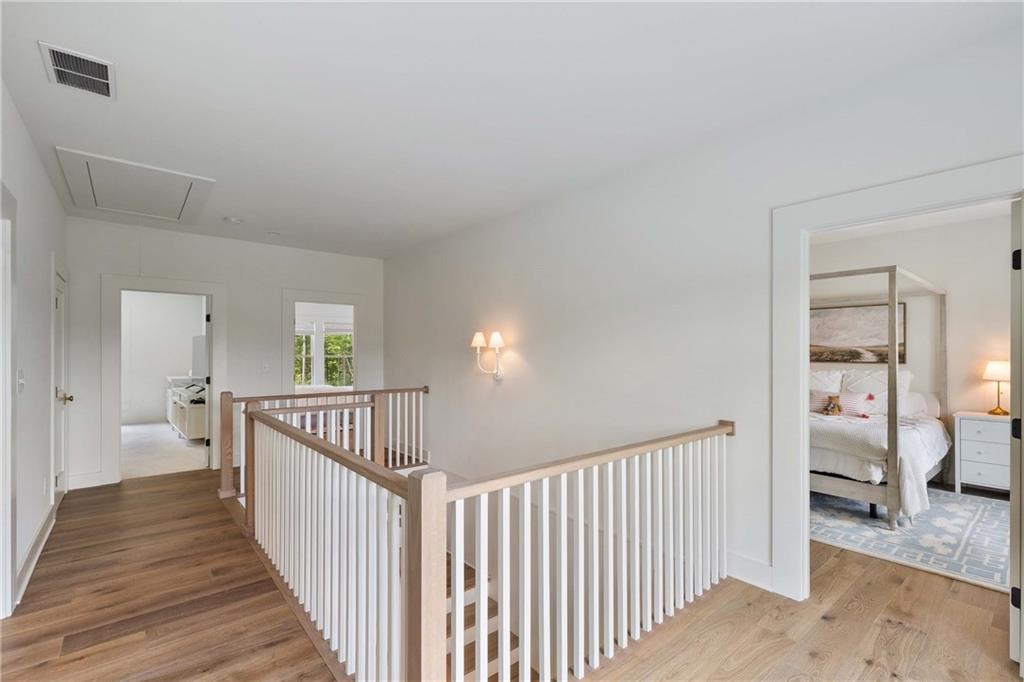 9311 Waterworks Road Chattahoochee Hills, GA 30268 - Photo 39 of 57 a view of a hallway view with wooden floor and windows