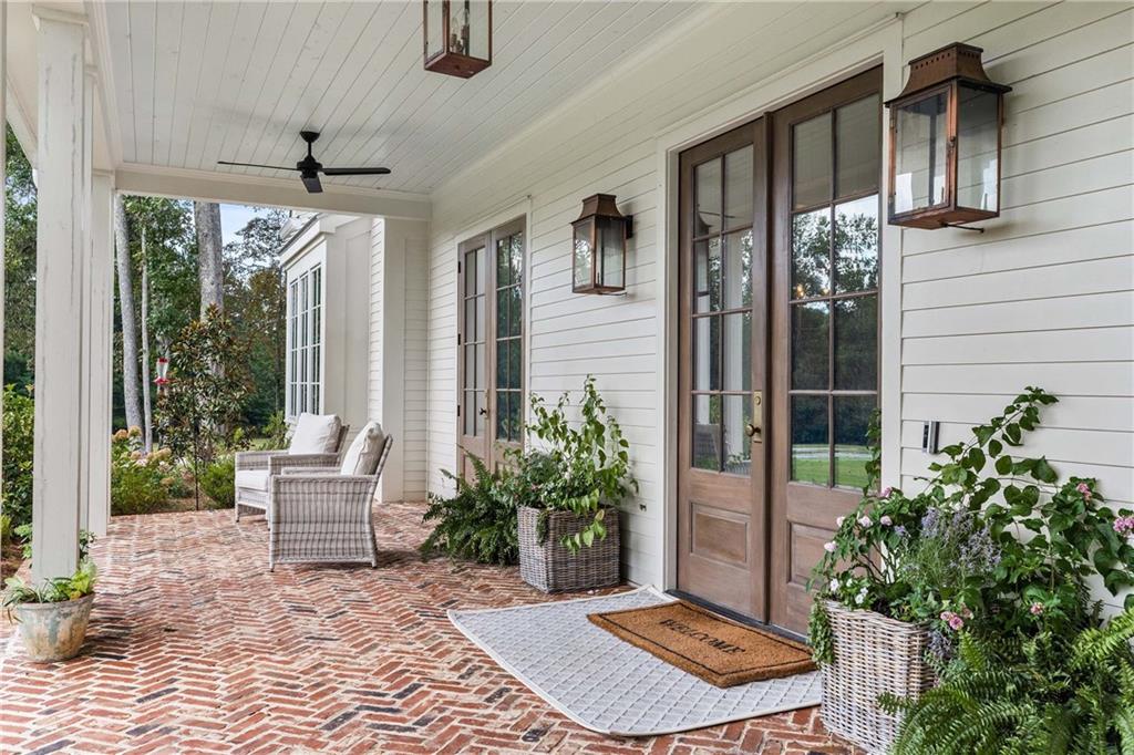 9311 Waterworks Road Chattahoochee Hills, GA 30268 - Photo 4 of 57 a backyard of a house with outdoor seating