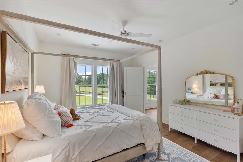 9311 Waterworks Road Chattahoochee Hills, GA 30268 - Photo 41 of 57 a bedroom with a bed and a large window