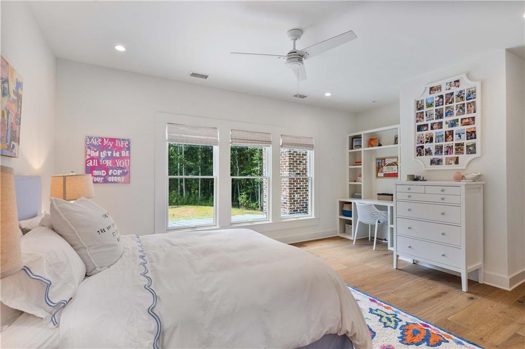 9311 Waterworks Road Chattahoochee Hills, GA 30268 - Photo 44 of 57 a spacious bedroom with a bed and a window