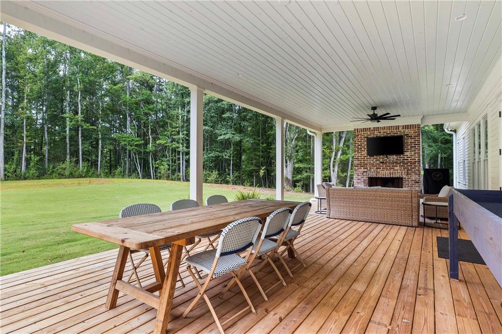 9311 Waterworks Road Chattahoochee Hills, GA 30268 - Photo 52 of 57 a patio with yard table and chairs