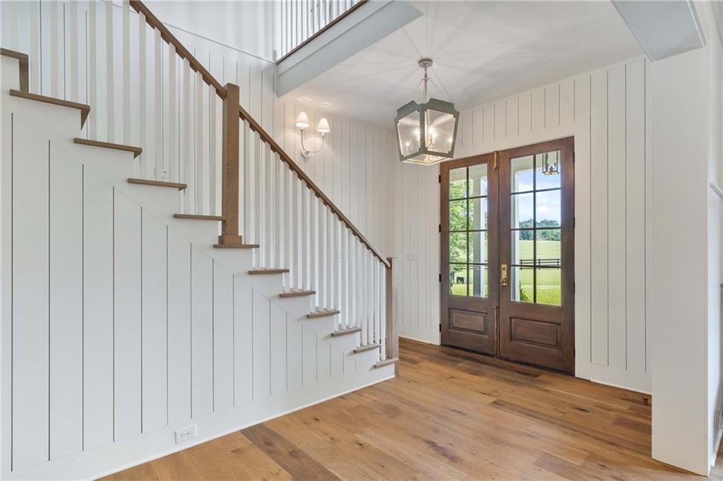 9311 Waterworks Road Chattahoochee Hills, GA 30268 - Photo 6 of 57 a view of entryway and hall with wooden floor