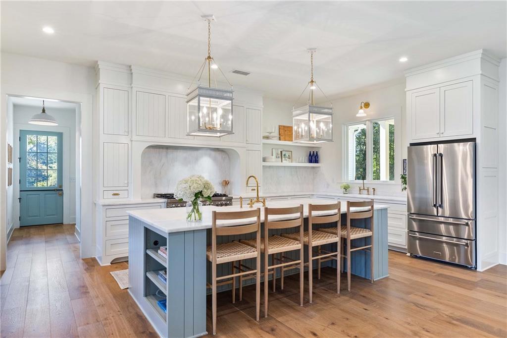 9311 Waterworks Road Chattahoochee Hills, GA 30268 - Photo 8 of 57 a kitchen that has a table and chairs in it