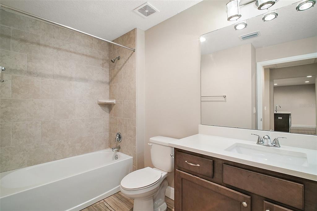 444 Fahnstock Street Eustis, FL 32726 - Photo 16 of 25 a bathroom with a sink a toilet and a bathtub