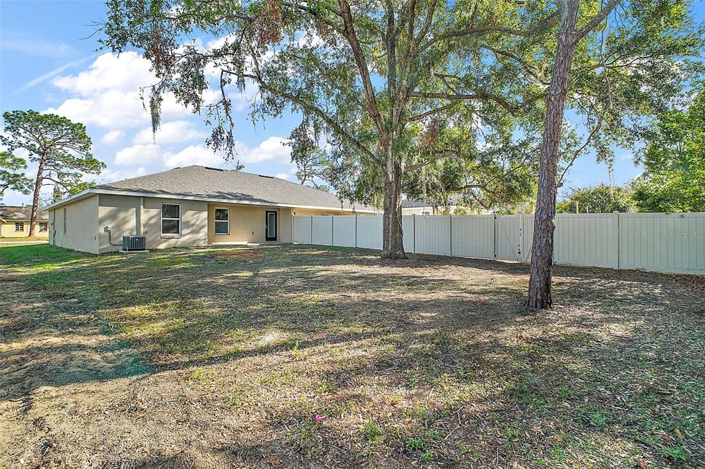 444 Fahnstock Street Eustis, FL 32726 - Photo 22 of 25 a house with trees in the background