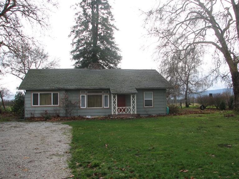 10083 Table Rock Road White City, OR 97503 - Photo 2 of 22 a front view of house with yard and green space