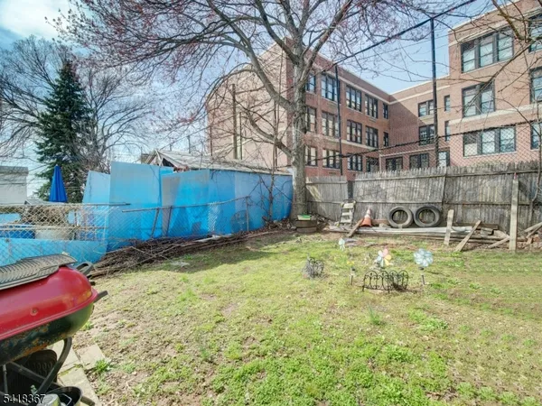 a view of a swimming pool with a backyard